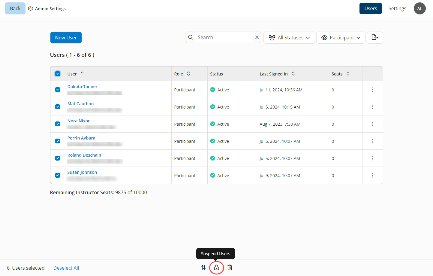 Multiple users selected with the bulk actions menu shown and Suspend Users option identified