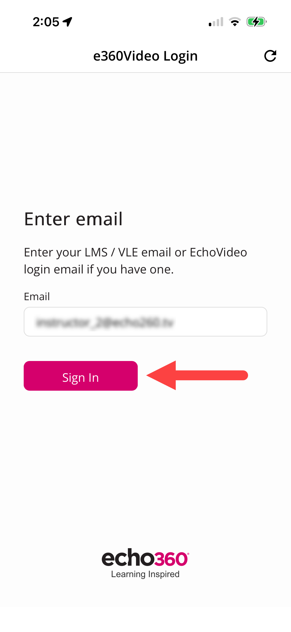 Mobile app with email populated and the Sign In button identified as described